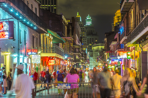 NEW ORLEANS, USA - JULY 14, 2013: Neon lights in the French Quarter in New Orleans, USA. Tourism provides a much needed source of revenue after the 2005 devastation of Hurricane Katrina.