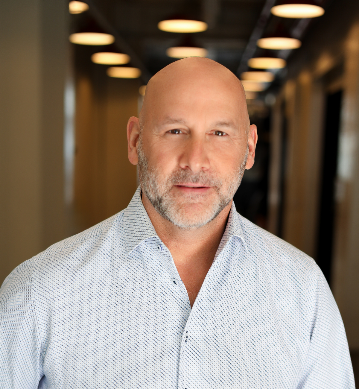 headshot of man in dress shirt