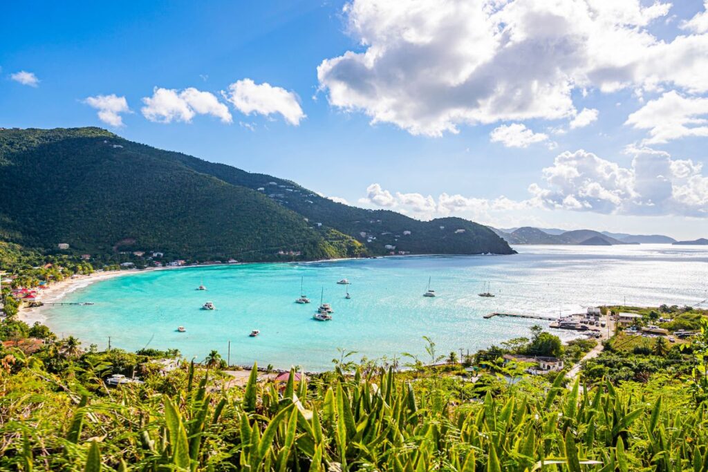 bay of tortola with boats on light blue water