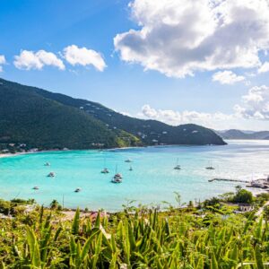 bay of tortola with boats on light blue water